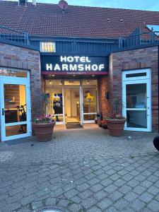 a hotel hammission sign on the front of a building at Hotel Harmshof Bispingen in Bispingen