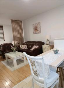 a living room with a couch and a table at Nektar 88 in Vrnjačka Banja +42 photos
