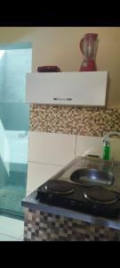 Køkken eller tekøkken på Abaré Slim Suítes