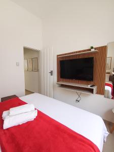 En eller flere senge i et værelse på Flats a 4km do Centro Histórico e cachoeiras