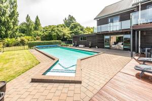 a swimming pool in the backyard of a house at Hillside Haven in Whanganui