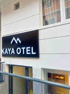 a sign on the side of a building at Kaya Hotel in Antalya