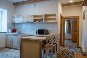 Kuchyň nebo kuchyňský kout v ubytování Apartmány Lúčny Raj