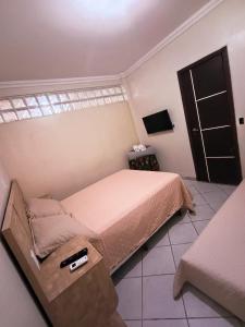 Postel nebo postele na pokoji v ubytování Apto inteiro 3 quartos, sendo duas suítes