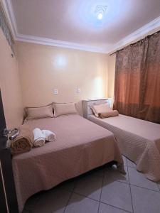 Postel nebo postele na pokoji v ubytování Apto inteiro 3 quartos, sendo duas suítes