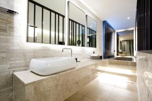 a bathroom with a white tub on a counter at Hotel Forestar in Seoul