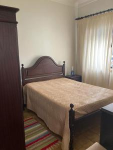 En eller flere senge i et værelse på Casa da Praia