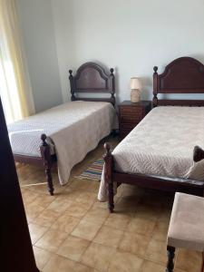 En eller flere senge i et værelse på Casa da Praia