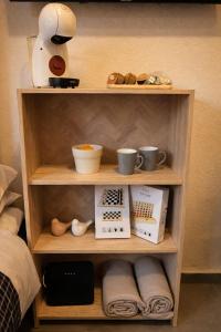 Příslušenství pro přípravu čaje a kávy v ubytování Alojamiento cerca de la Playa + 3 fotografie