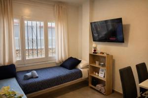 TV a/nebo společenská místnost v ubytování Alojamiento cerca de la Playa