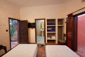 Ένα ή περισσότερα κρεβάτια σε δωμάτιο στο Gite Souss