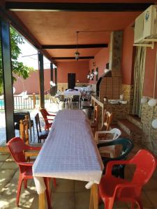 a white table and chairs on a patio at Casa rural en Granada in Atarfe