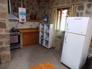 Køkken eller tekøkken på Cabañas Wasirumi