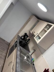 an overhead view of a kitchen with a sink at Haus Heiken Apartment Sonnenblume in Altenburg +19 photos