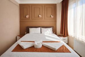 En eller flere senge i et værelse på Ayasofya Bella Vista APART