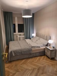 Postel nebo postele na pokoji v ubytování Widok na stawy + 13 fotografií