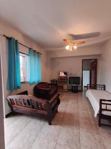 En eller flere senge i et værelse på Praia de Muriqui