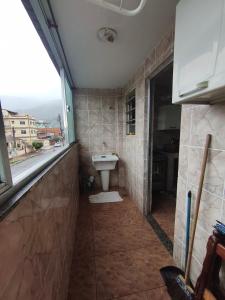 Et badeværelse på Praia de Muriqui