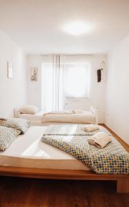 Giường trong phòng chung tại Ice Queen Vlasic