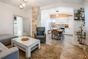 a living room with a couch and a table at Apartment MATEJA in Tivat