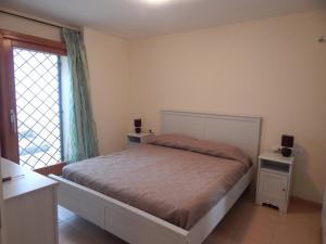 Llit o llits en una habitació de Villa A Schiera Porto Pozzo
