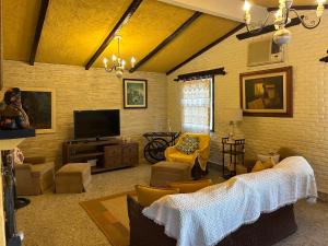 Et tv og/eller underholdning på CASA com piscina em ITAIPAVA RJ, no Condomínio Vale da Boa Esperança