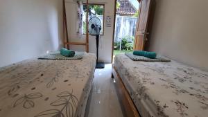 Postel nebo postele na pokoji v ubytování The Backyard Hostel