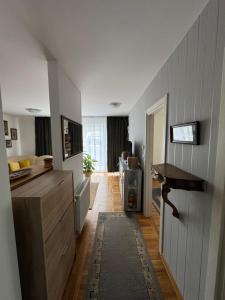 a kitchen with a counter and a table in a room at Mira in Čajetina