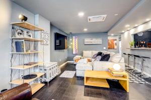 a living room with a couch and a table at 'Little House on the Lot' Dryden Townhome: Pets OK in Dryden
