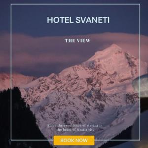 een boek met een foto van een berg bij Hotel Svaneti in Mestia