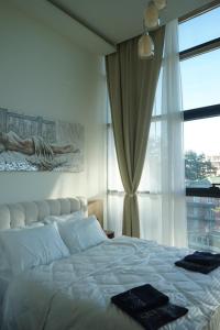 Postel nebo postele na pokoji v ubytování Sky Spa Zlatibor + 16 fotografií