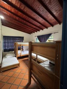 Postel nebo postele na pokoji v ubytování La Escondida, con acceso al lago