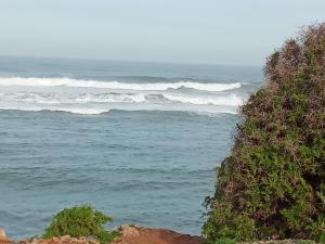 a view of the ocean with waves at Villa harhora in Temara +10 photos