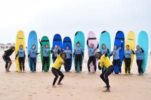 a group of people standing in front of surfboards at Mabidi Surf Taghazout in Taghazout
