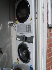 two washing machines stacked on top of each other at Delegate Galley Cabin in Delegate