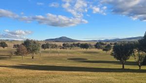 a golf course with a hole in the middle of a field at Delegate Galley Cabin in Delegate