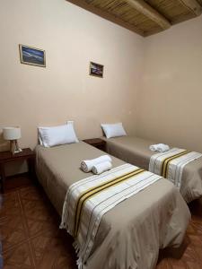 En eller flere senge i et værelse på El Amanecer