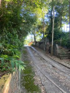 a dirt road with trees on the side of it at Cabaña Conectar Naturaleza in Ituzaingó
