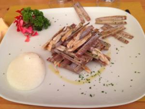 a plate of food with pasta and vegetables on it at Cavallino House Boat in Cavallino-Treporti +2 photos