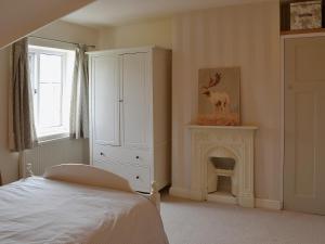 Giường trong phòng chung tại Barrowswood