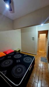 En eller flere senge i et værelse på Casa de Praia Itanhaem