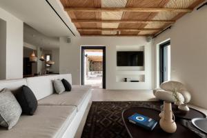 Et opholdsområde på Private Villa Houlakia Mikonos