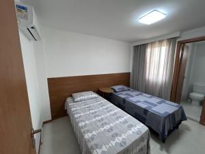 Giường trong phòng chung tại Village Acqua Guarajuba +6 ảnh