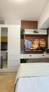 a bedroom with a white bed and a window at Vinyce Studio in Cagayan de Oro +69 photos
