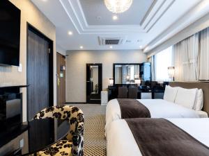 TV a/nebo společenská místnost v ubytování APA Hotel & Resort Midosuji Hommachi Ekimae Tower