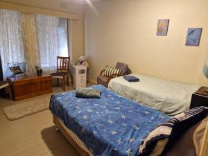 Ένα ή περισσότερα κρεβάτια σε δωμάτιο στο Farm On The Orchards