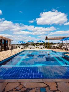 Swimmingpoolen hos eller tæt på Pousada Recanto da Preguiça