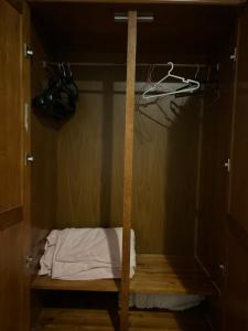 a room with a closet with a bed in it at MALÔ - Queluz in Queluz