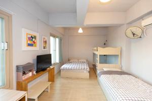 Ένα ή περισσότερα κρεβάτια σε δωμάτιο στο Wandonesia