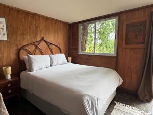 En eller flere senge i et værelse på Cabañas en el Bosque a 5 minutos del mar - Estancia CH + 180 billeder